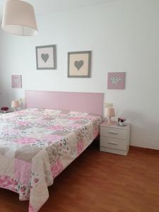 a bedroom with a bed and a dresser and a bed sidx sidx sidx sidx at Sol y Luz in Isla del Moral