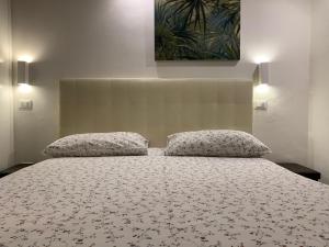 Giường trong phòng chung tại Stayinbologna 2