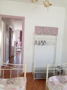 a room with two bunk beds and a hallway at Sol y Luz in Isla del Moral