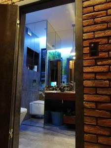 a bathroom with a sink and a mirror at Apartament na Mazurach in Ełk