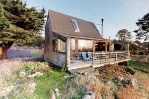 a house with a porch with a dining room at Thayer House in Sea Ranch