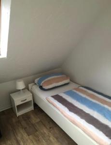 Postel nebo postele na pokoji v ubytování Ferienwohnung Nr. 1 - Südstrand