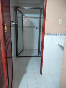 a shower with a glass door in a bathroom at Hotel Esmeralda in Poza Rica de Hidalgo +48 photos