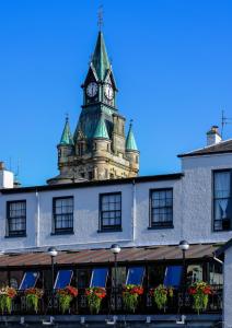a building with a clock on the front of it at The City Hotel in Dunfermline
