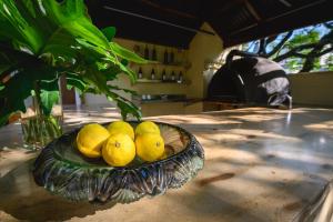 a bowl of lemons sitting on a table at Hub Porteño in Buenos Aires