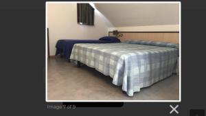 Voodi või voodid majutusasutuse HOTEL LE MORGE toas