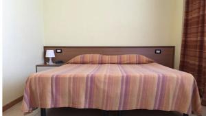 Postel nebo postele na pokoji v ubytování HOTEL LE MORGE