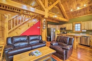 a living room with leather furniture in a cabin at Ski Lodge Mtn Retreat with Fire Pit, Deck and Views! in Starksboro