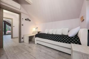 Posteľ alebo postele v izbe v ubytovaní Apartament Marron