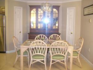a dining room with a table and four chairs at Hilton Head Resort Condo 1 Mile to Shelter Cove! in Hilton Head Island