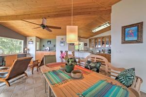a dining room and kitchen with a table and chairs at Direct Oceanfront, Big Island Vacation Rental Home in Keaau