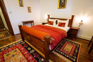 A bed or beds in a room at Complex Turistic "Moara Dragaicilor"