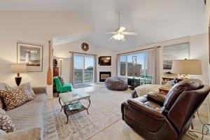 a living room with a couch and a chair at Newport House at Nye Beach in Newport