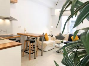 a living room with a table and a couch at Stelisia Rooms in Chania