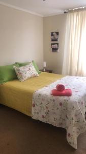 Condominio Las Cortezas tesisinde bir odada yatak veya yataklar