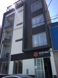 a black and white building with a sign on it at Nivial in Tacna