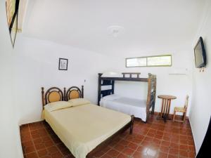 Кровать или кровати в номере Hostal Dumbira