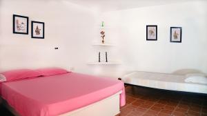 Postel nebo postele na pokoji v ubytování Hostal Dumbira