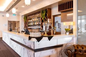 a bar in a hotel room with a counter at Port Lincoln Hotel in Port Lincoln