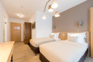 Letto o letti in una camera di Berdorfer Eck - Bed&Breakfast