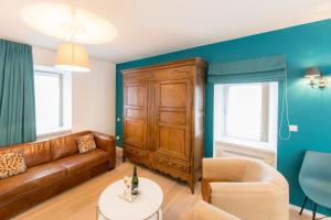 a living room with a couch and a table at Berdorfer Eck in Berdorf