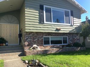 a house with a front door and a window at Berkie’s Bed & Breakfast in Port Alberni