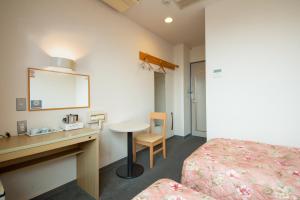 Llit o llits en una habitació de Hotel Hana