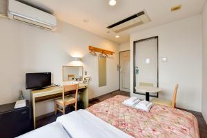 Llit o llits en una habitació de Hotel Hana