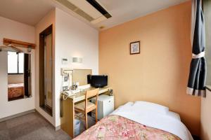 Llit o llits en una habitació de Hotel Hana