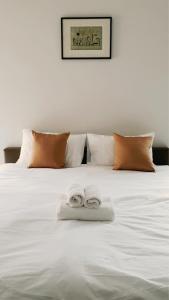 Ένα ή περισσότερα κρεβάτια σε δωμάτιο στο Prinya house ปริญญา เฮ้าส์