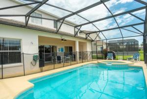 a large swimming pool with a glass roof at Sweet Memories in Kissimmee