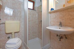 a bathroom with a toilet and a sink and a shower at Liliana in Medulin * Istrien in Medulin +25 photos