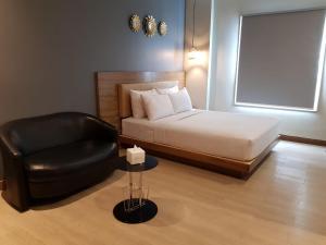 Ένα ή περισσότερα κρεβάτια σε δωμάτιο στο U Stay Hotel Mangga Besar