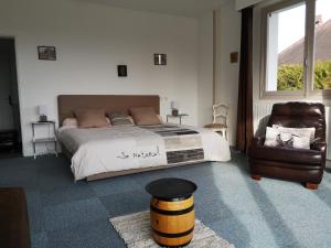 En eller flere senge i et værelse på La Marquière - Gite Val de Loire