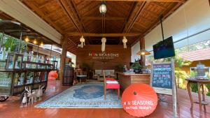 a store with a store front with tables and chairs at Nan Seasons Boutique Resort in Nan