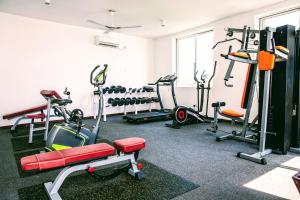 a gym with several treadmills and exercise machines at Nungwi Dreams by Mantis in Nungwi