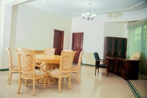 a dining room with a table and chairs at Luxury Apartment with Ocean View in Oyster Bay in Dar es Salaam