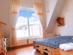 Postel nebo postele na pokoji v ubytování Dốc homestay Đà Lạt