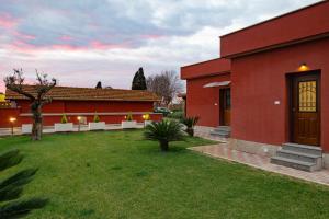 Vonkajšia záhrada v ubytovaní Domus Porto Di Traiano Resort