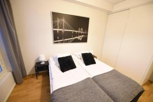 Tempat tidur dalam kamar di Rental Apartment Lonttinen Suomen Vuokramajoitus Oy
