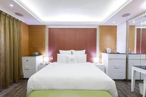 Ліжко або ліжка в номері 168 Motel-PingZhen
