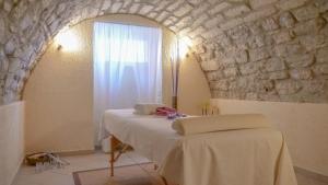 Postel nebo postele na pokoji v ubytování Hotel Gardenia al Lago