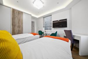 City Prime Apartments客房内的一张或多张床位