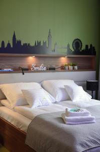 Łóżko lub łóżka w pokoju w obiekcie AGA Tenis Apartments by Radwańska