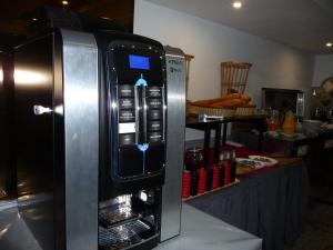 a refrigerator with its door open in a kitchen at HOTEL KAMAL CITY CENTER in Agadir
