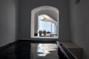 Fotografie z fotogalerie ubytování Nefeles Luxury Suites ve Fiře
