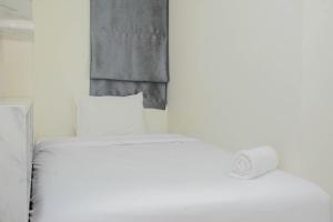 Кровать или кровати в номере Pleasant and Modern 2BR Grand Kamala Lagoon Apartment By Travelio +16 фотографий