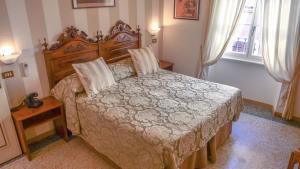Postel nebo postele na pokoji v ubytování Hotel Du Lac