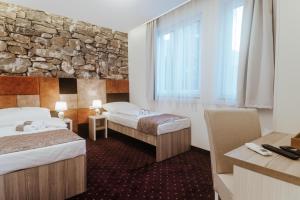 Postel nebo postele na pokoji v ubytování Hotel & Spa Meydan