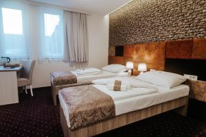 Postel nebo postele na pokoji v ubytování Hotel & Spa Meydan